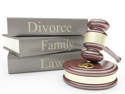 Divorce and family law books behind a gavel with two gold wedding bands