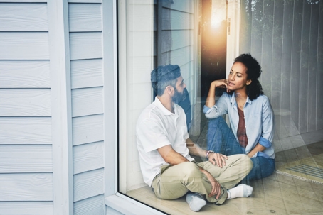 Couple talking by the window